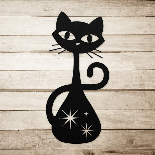 A black atomic cat metal wall art on a simple wood plank background.