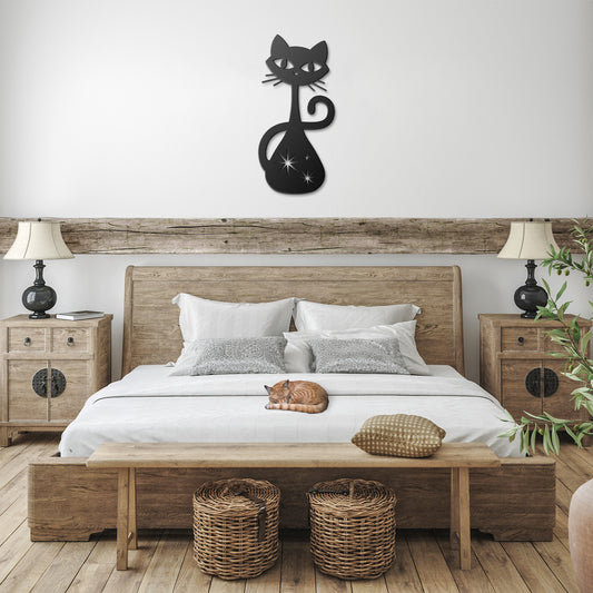 A black atomic cat metal wall art hanging in a farmhouse bedroom.