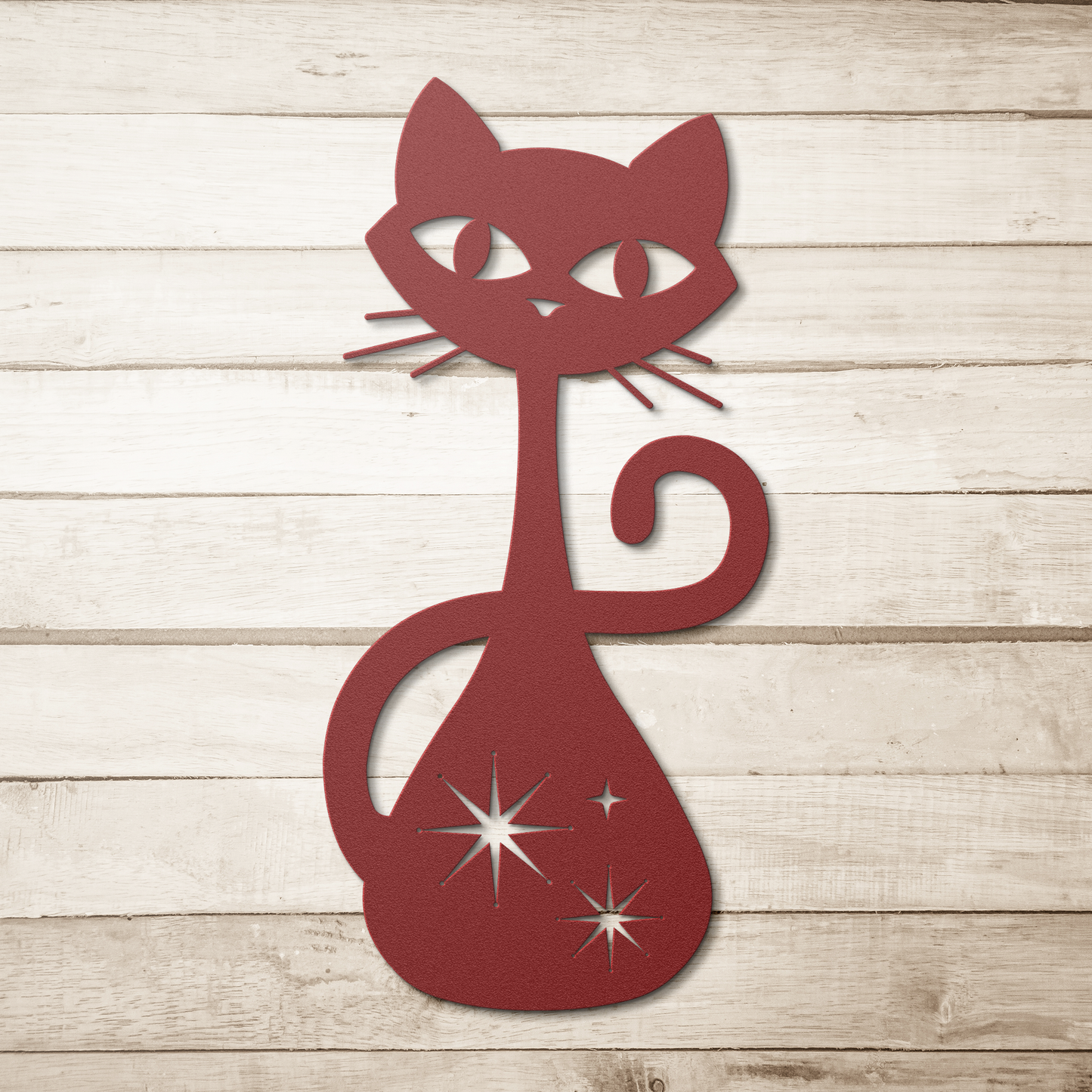 A red atomic cat metal wall art on a simple wood plank background.