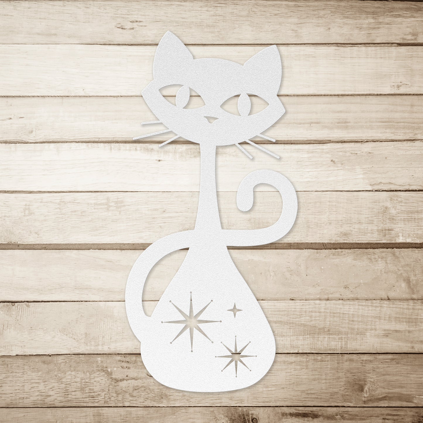 A white atomic cat metal wall art on a simple wood plank background.